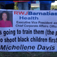 A protester holds a banner outside RWJBArnabas Health
